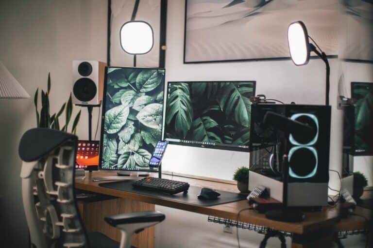 Streaming desk setup with monitors, illustrating where a brat style Twitch banner appears on a channel page